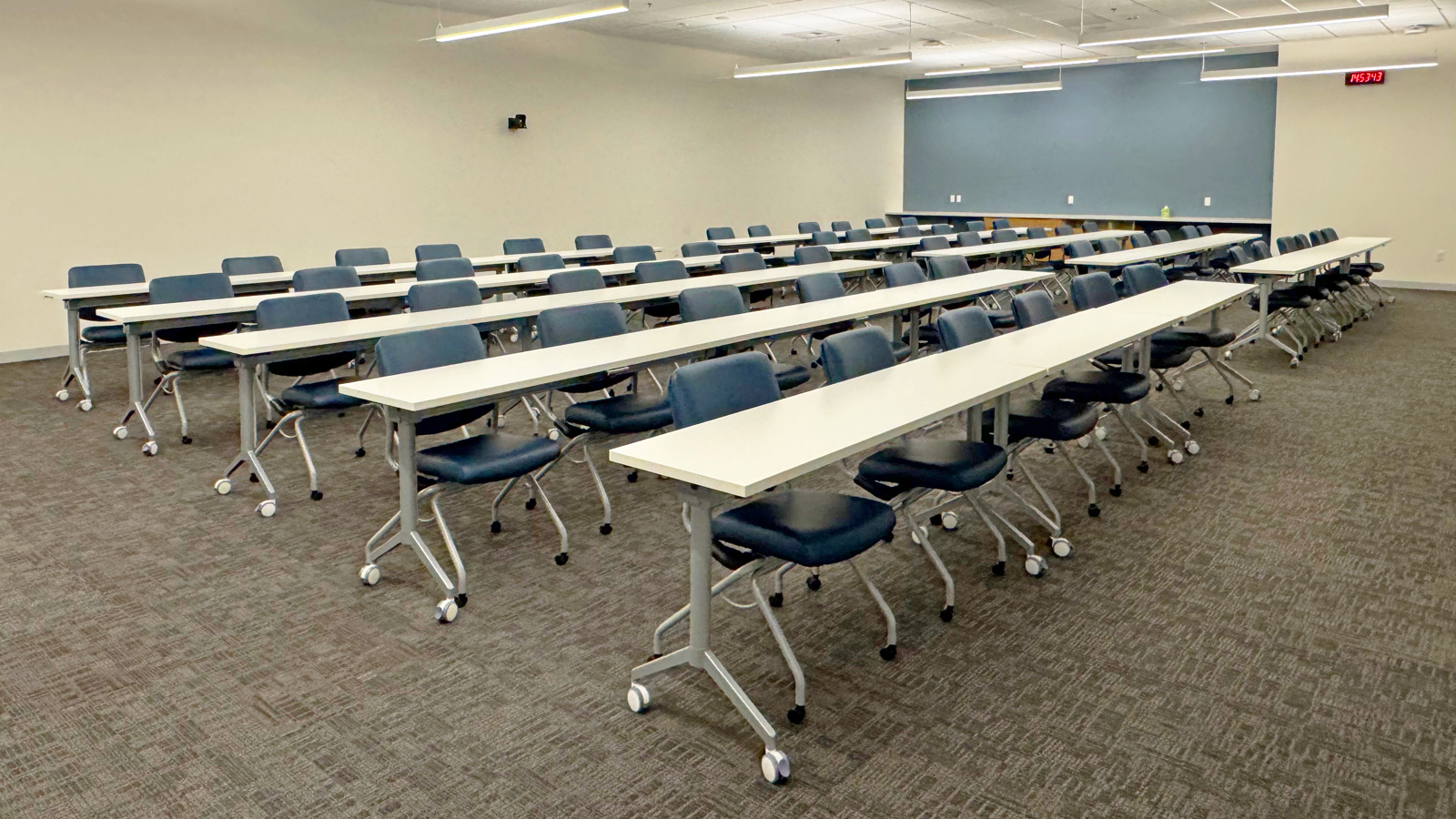 Training room installation with nesting tables and mobile task chairs