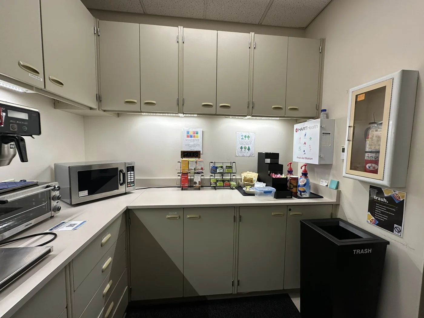 Cluttered, dated office kitchenette corner before the refresh